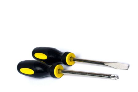 Yellow and black handled screwdrivers on white backgroundの写真素材