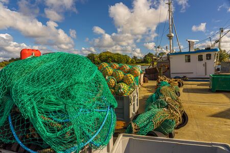 Fishing nets on a fishing cutter or fishing boat in port Overfishing Fisheries