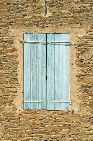 Old Window With shutters and Stone Wallの写真素材