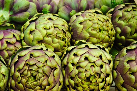 Lots of fresh globe Artichokes in a market standの写真素材