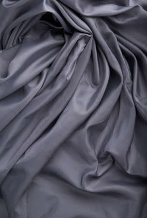 abstract background grey silk fabric with wavesの写真素材