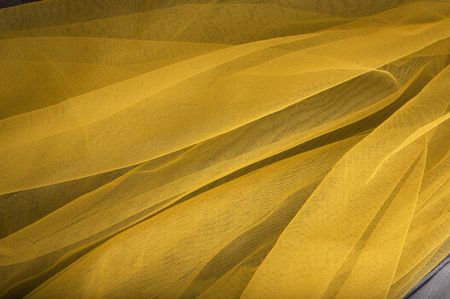 abstract background yellow veil fabric with wavesの写真素材