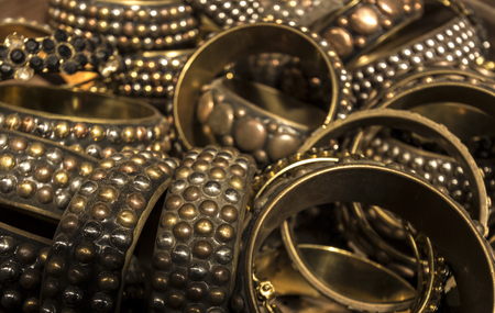 Heap of Gold and Brass decorated braceletsの写真素材