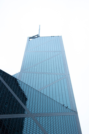 Office building with glass window on facade in urban architecture big city. Bottom view glass...