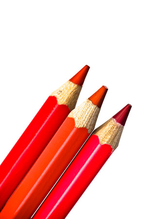 Three red colored crayonsの写真素材