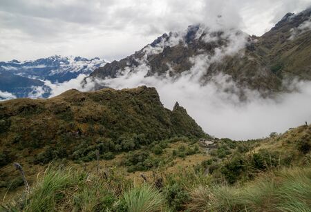 Mysterious Inca building and cloudy mountains on the way to Maccu Picchuの写真素材
