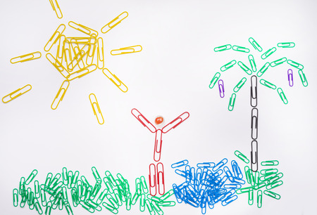 Office happiness concept - happy oasis made of paper clipsの写真素材