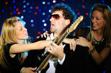 Male guitar player on stageの写真素材