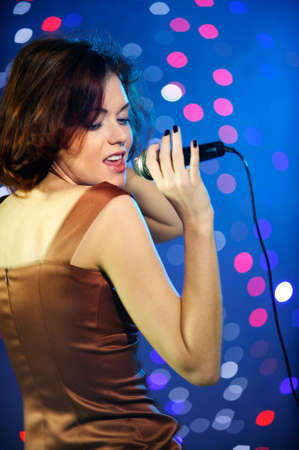 Beautiful female singer on stage