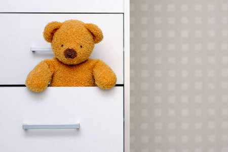 Teddy bear in dresserの写真素材