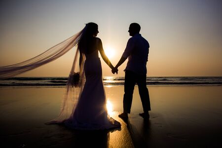 Lovers were married in India. Walk on the beachの写真素材