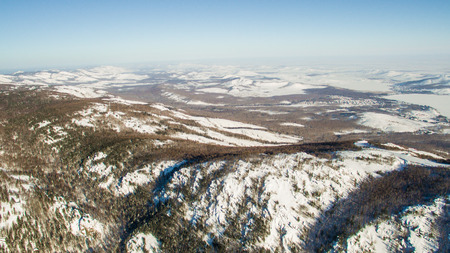 Russian Ural mountains in winter. Aerial view of the lake and the endless landscapesの写真素材