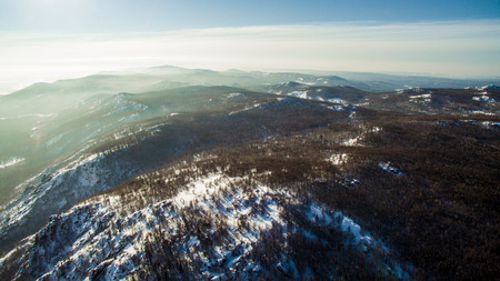 Russian Ural mountains in winter. Aerial view of the lake and the endless landscapesの写真素材