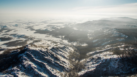 Russian Ural mountains in winter. Aerial view of the lake and the endless landscapesの写真素材