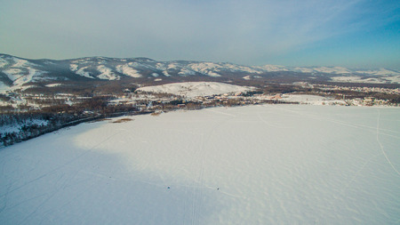 Russian Ural mountains in winter. Aerial view of the lake and the endless landscapesの写真素材