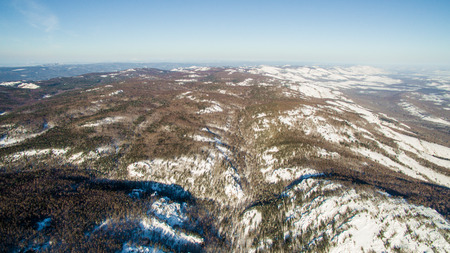 Russian Ural mountains in winter. Aerial view of the lake and the endless landscapesの写真素材