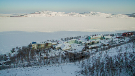 Russian Ural mountains in winter. Aerial view of the lake and the endless landscapesの写真素材