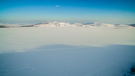 Russian Ural mountains in winter. Aerial view of the lake and the endless landscapesの写真素材