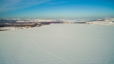 Russian Ural mountains in winter. Aerial view of the lake and the endless landscapesの写真素材