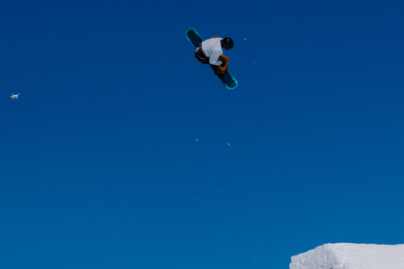 2017 04 Festival NewStarCamp: snowboarder jumps from a high springboard with droneのeditorial素材