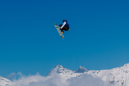 2017 04 Sochi, Russia, Festival NewStarCamp: snowboarder jumps from a high springboardのeditorial素材