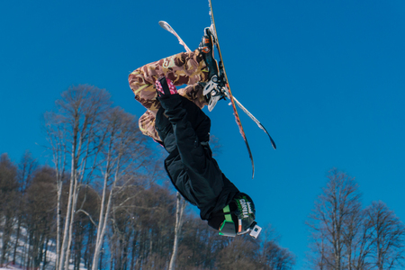 The skier in mountains in flight from a springboardのeditorial素材
