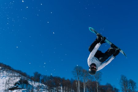 2017 04 Sochi, Russia, Festival NewStarCamp: snowboarder jumps from a high springboardのeditorial素材