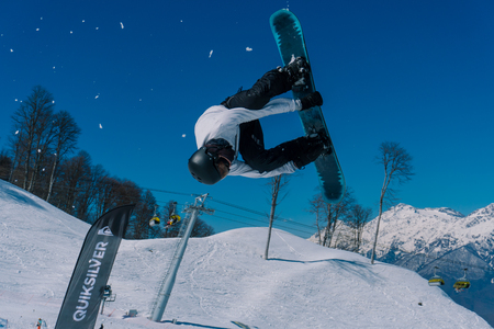 2017 04 Sochi, Russia, Festival NewStarCamp: snowboarder jumps from a high springboardのeditorial素材