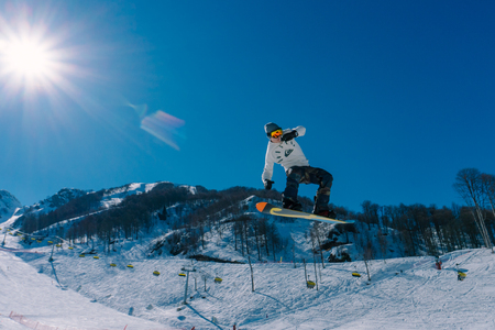 2017 04 Sochi, Russia, Festival NewStarCamp: snowboarder jumps from a high springboardのeditorial素材