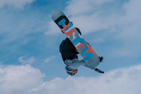 2017 04 Sochi, Russia, Festival NewStarCamp: snowboarder jumps from a high springboardのeditorial素材
