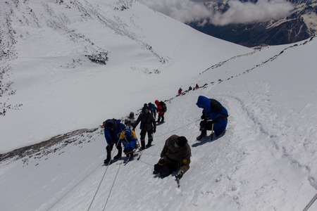 2014 Mount Elbrus, Russia: climbing to the top with a disabled person.のeditorial素材