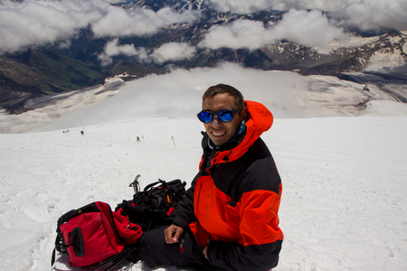 A man makes selfie in yhe slope of Elbrus mountainの写真素材
