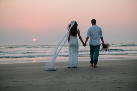 Lovers were married in India. Walk on the beachの写真素材