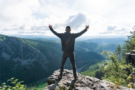 Man stay in a peak in Ural mountainsの写真素材