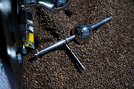 Mixing roasted coffee