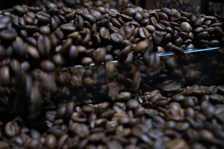 Mixing roasted coffeeの写真素材