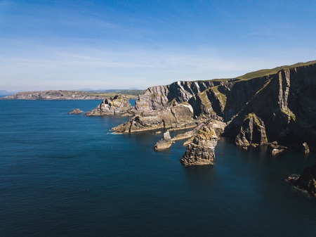 Island cliffs in Ireland, Aerial view in summerの写真素材