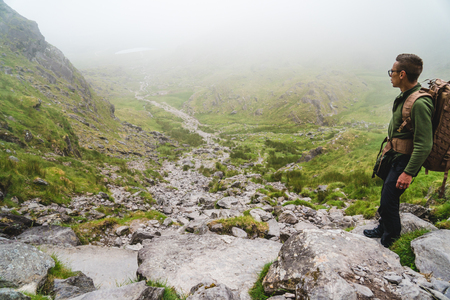 The man on the trail to Carrauntoohil. On the devils ladderの写真素材