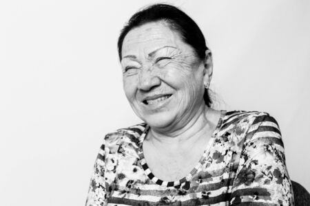 Portrait of laughing elderly senior woman, black and white photo.の写真素材