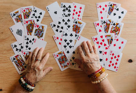 Guessing cards reading, grandma magic, fortune telling, women hands, destiny predictionの写真素材