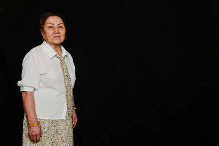 Portrait of an elderly senior Asian woman, smiling when thinking about her lifeの写真素材