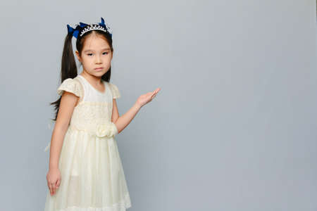 Portrait of a cute 6 years old Asian girl. "what's happening?" modeの写真素材