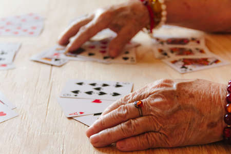 Guessing cards reading, grandma magic, fortune telling, women hands, destiny predictionの写真素材