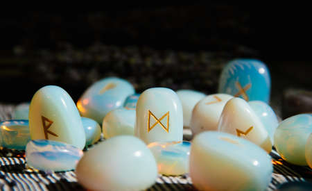 Close up of rune stones on wooden tableの写真素材