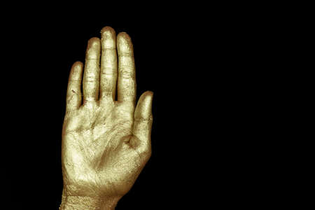 Golden hand raised up, pop art collage style in neon bold colors. Can be used for posters, banners, wallpaper. Magazine style.の写真素材