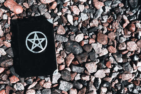 Black magic book. Beautiful occult ritual. Power of earth and stone.の写真素材