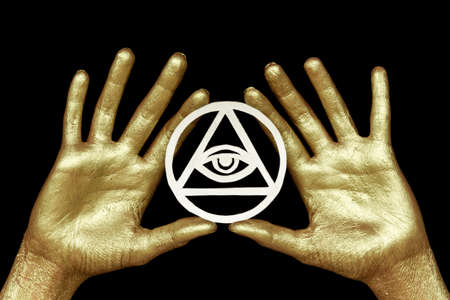 New age modern magic, occult symbol for ritual. Eye of Providence in golden hands on black background. For posters, banners, wallpapers.の写真素材
