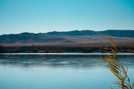 A beautiful autumn landscape, the river with clear water in a hilly area in Asiaの写真素材