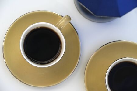 espresso coffee cups viewed from above on white backgroundの写真素材