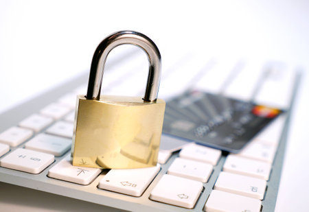 padlock and credit card on keyboardの写真素材